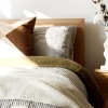 a bedroom with a bed and a nightstand