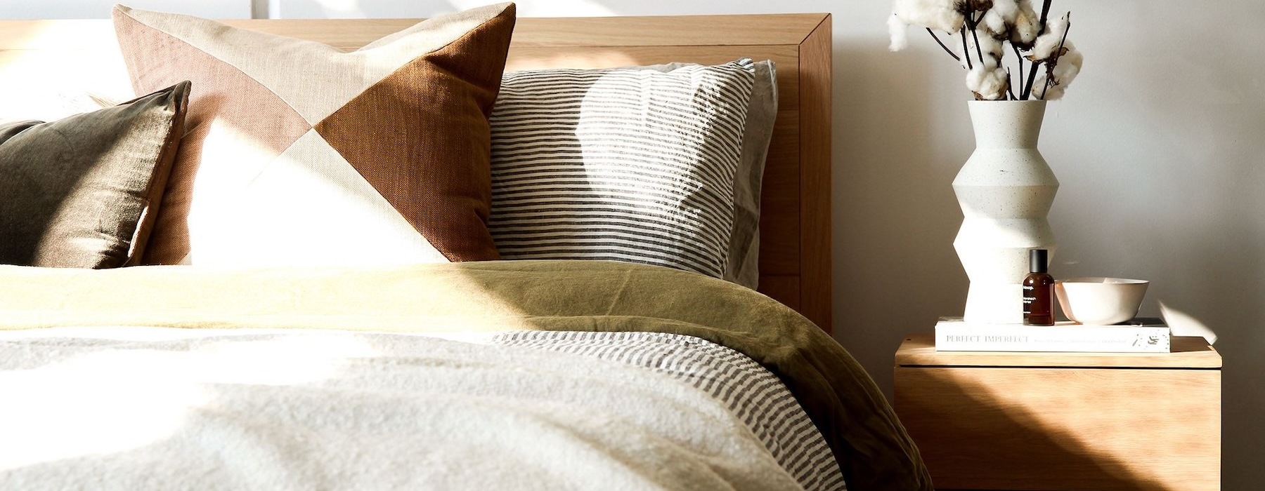 a bedroom with a bed and a nightstand